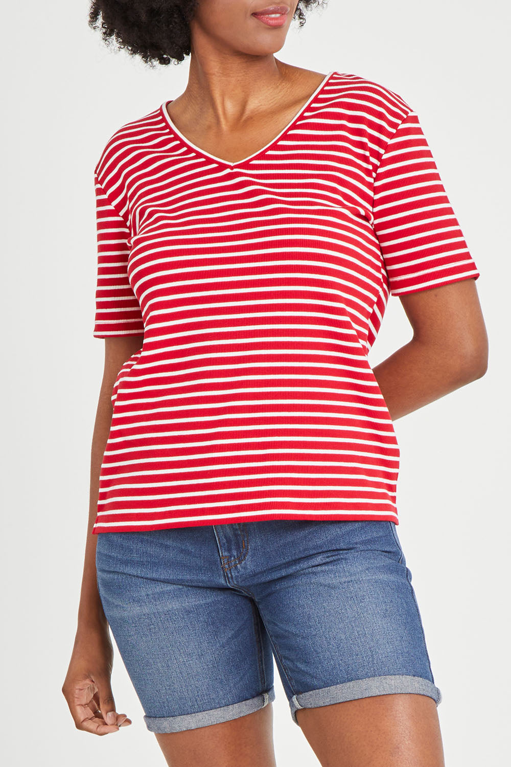 Model Aiyana wearing size 10 of The Keepers V Neck Striped Rib Tee in colour Red (Red), from the front, cropped image