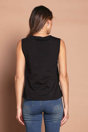 Model Madeline wearing size 10 of The Keepers Classic Tank in colour Black (Black), from the back