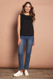 Model Madeline wearing size 10 of The Keepers Classic Tank in colour Black (Black), from the front, showing the whole outfit