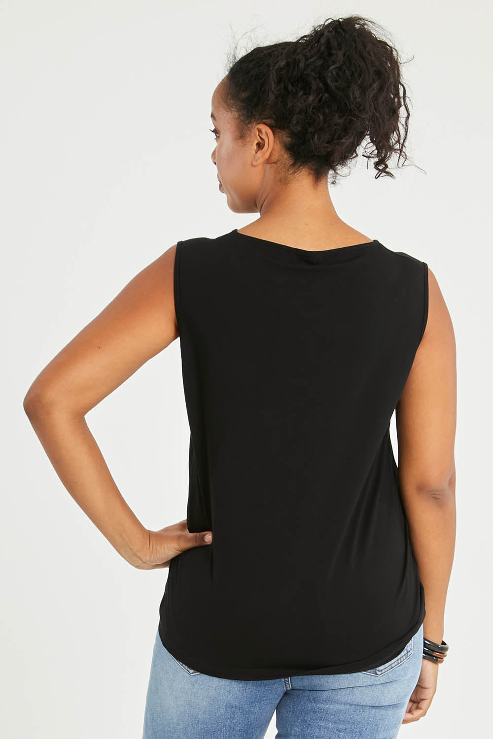 Model Noli wearing size 14 of The Keepers Classic Tank in colour Black (Black), from the back