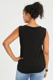 Model Noli wearing size 14 of The Keepers Classic Tank in colour Black (Black), from the back