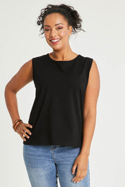 Model Noli wearing size 14 of The Keepers Classic Tank in colour Black (Black), from the front, cropped image
