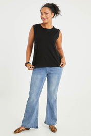 Model Noli wearing size 14 of The Keepers Classic Tank in colour Black (Black), from the front, showing the whole outfit