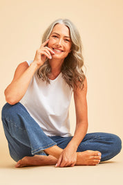 Model Luisa wearing size 10 of The Keepers Classic Tank in colour White (White), from the front, showing the whole outfit