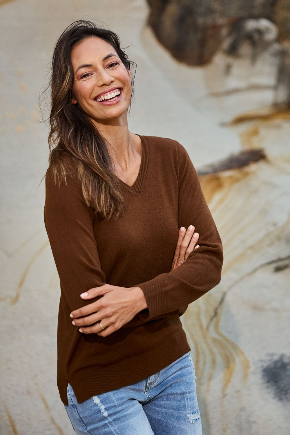 Model Amanda wearing size S of The Keepers Soft V Neck Jumper in colour Bark, from the front, showing the whole outfit