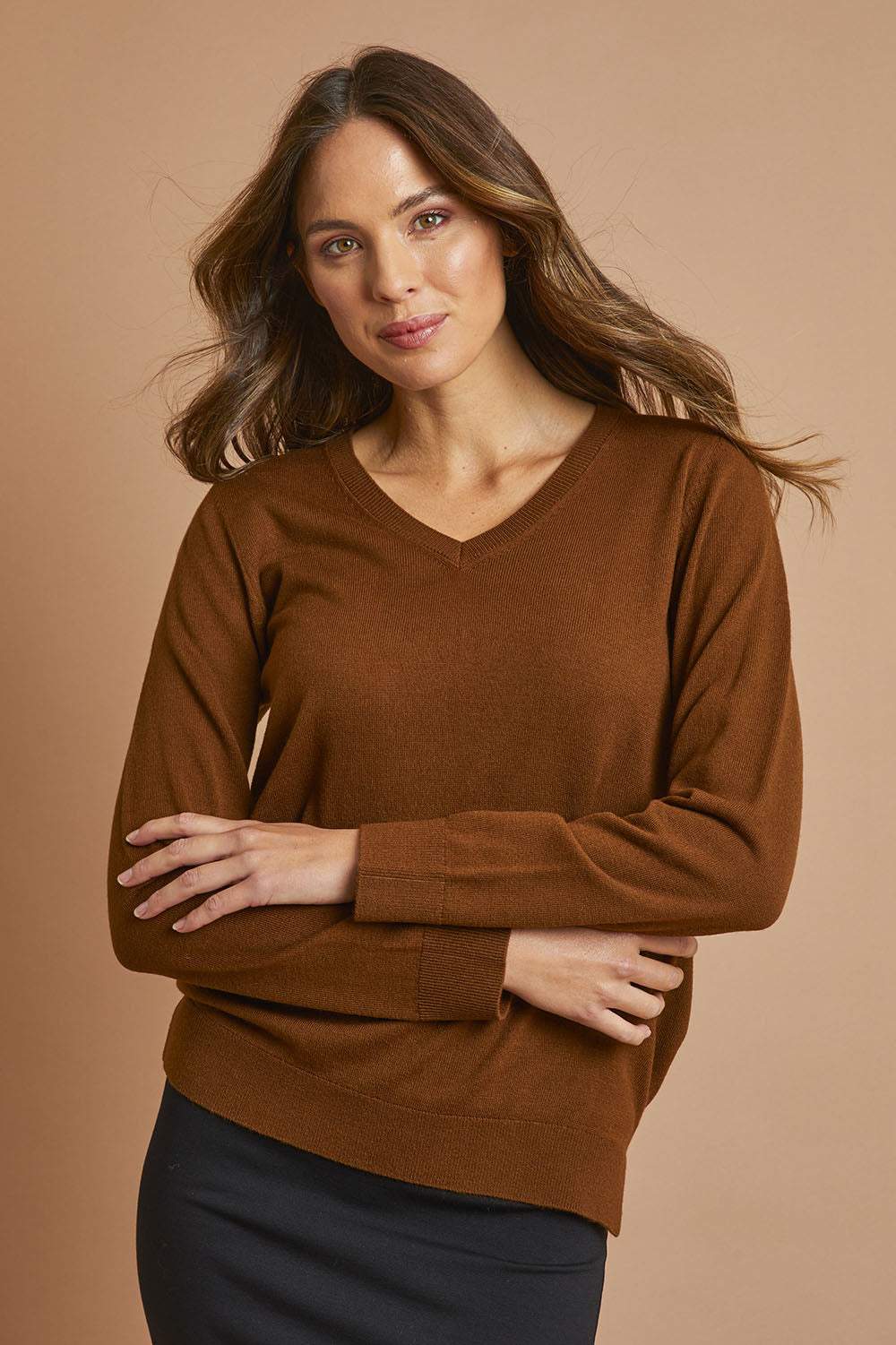 Model Madeline wearing size S of The Keepers Soft V Neck Jumper in colour Bark, from the front, showing the whole outfit