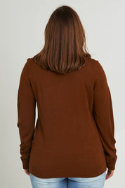 Model Monique wearing size L of The Keepers Soft V Neck Jumper in colour Bark, from the back