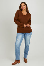 Model Monique wearing size L of The Keepers Soft V Neck Jumper in colour Bark, from the front, showing the whole outfit