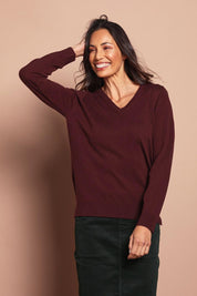 Model Amanda wearing size S of The Keepers Soft V Neck Jumper in colour Burgundy (Purple), from the front, cropped image