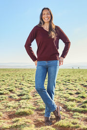 Model Amanda wearing size S of The Keepers Soft V Neck Jumper in colour Burgundy (Purple), from the front, showing the whole outfit
