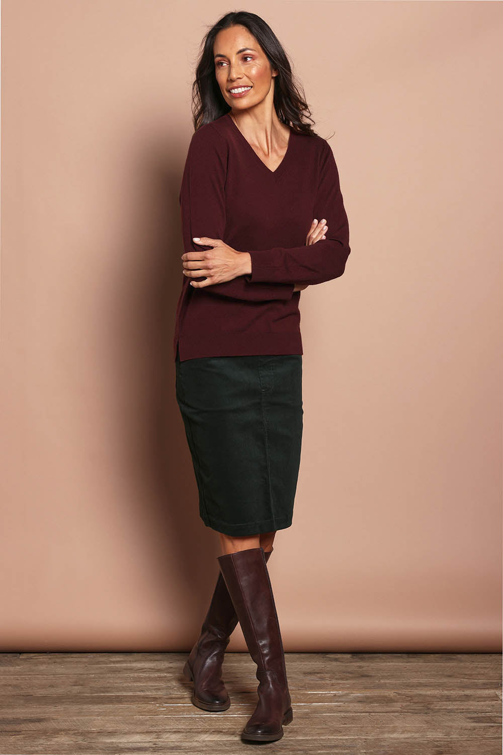Model Amanda wearing size S of The Keepers Soft V Neck Jumper in colour Burgundy (Purple), from the front, showing the whole outfit