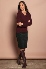 Model Amanda wearing size S of The Keepers Soft V Neck Jumper in colour Burgundy (Purple), from the front, showing the whole outfit