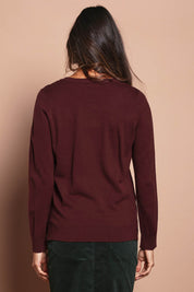 Model Jude wearing size S of The Keepers Soft V Neck Jumper in colour Burgundy (Purple), from the back