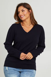 Model Monique wearing size L of The Keepers Soft V Neck Jumper in colour Darknavy (Blue), from the front, cropped image