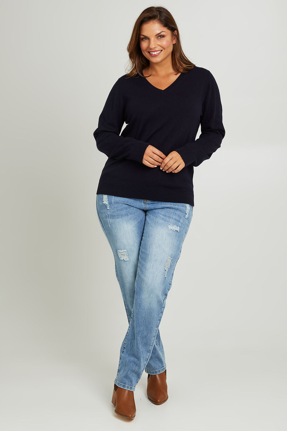 Model Monique wearing size L of The Keepers Soft V Neck Jumper in colour Darknavy (Blue), from the front, showing the whole outfit