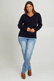 Model Monique wearing size L of The Keepers Soft V Neck Jumper in colour Darknavy (Blue), from the front, showing the whole outfit