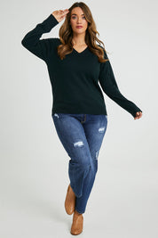Model Laura wearing size L of The Keepers Soft V Neck Jumper in colour Darkpetrol (Blue), from the front, showing the whole outfit