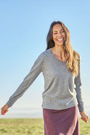 Model Amanda wearing size S of The Keepers Soft V Neck Jumper in colour Greymarle (Grey), from the front, showing the whole outfit