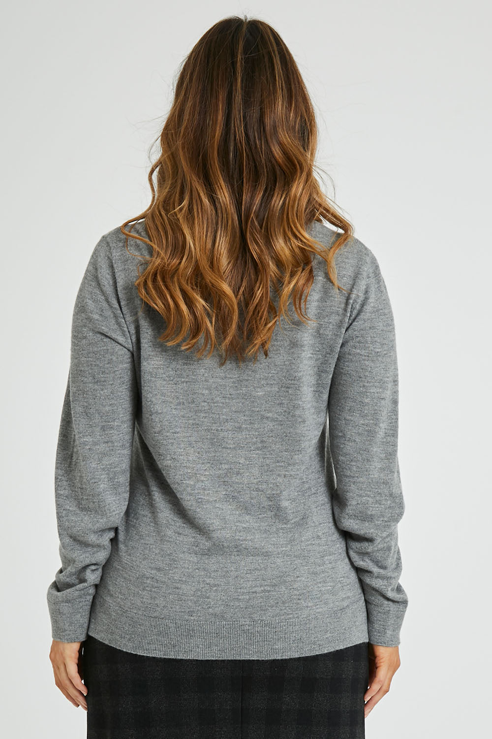 Model Laura wearing size L of The Keepers Soft V Neck Jumper in colour Greymarle (Grey), from the back
