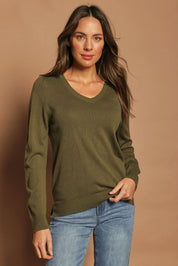 Model Madeline wearing size S of The Keepers Soft V Neck Jumper in colour Khaki (Green), from the front, showing the whole outfit