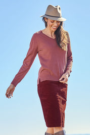 Model Amanda wearing size S of The Keepers Soft V Neck Jumper in colour Smokeyrose (Pink), from the front, showing the whole outfit