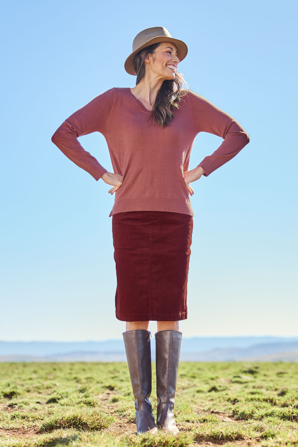 Model Amanda wearing size S of The Keepers Soft V Neck Jumper in colour Smokeyrose (Pink), from the front, showing the whole outfit