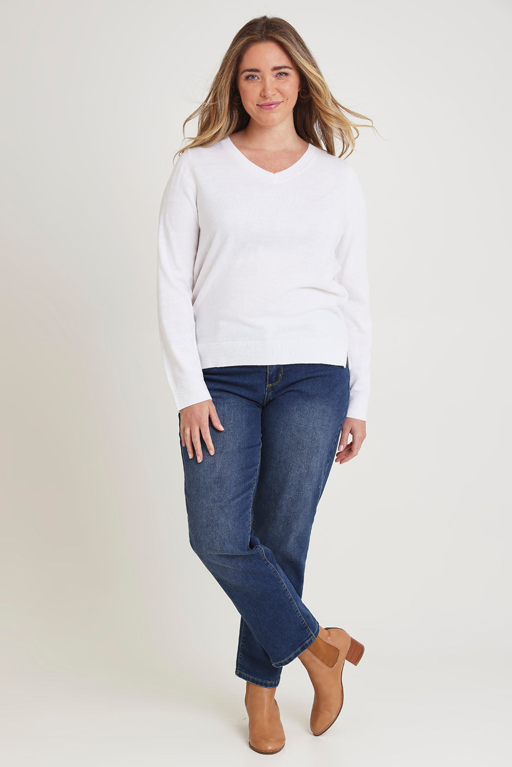 Model Chanel wearing size XL of The Keepers Soft V Neck Jumper in colour White (White), from the front, showing the whole outfit