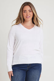 Model Tahnee wearing size XL of The Keepers Soft V Neck Jumper in colour White (White), from the front, cropped image