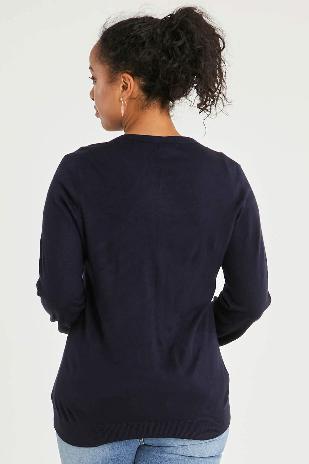 Model Noli wearing size L of The Keepers Soft Button Up Cardigan in colour Deepnavy (Blue), from the back