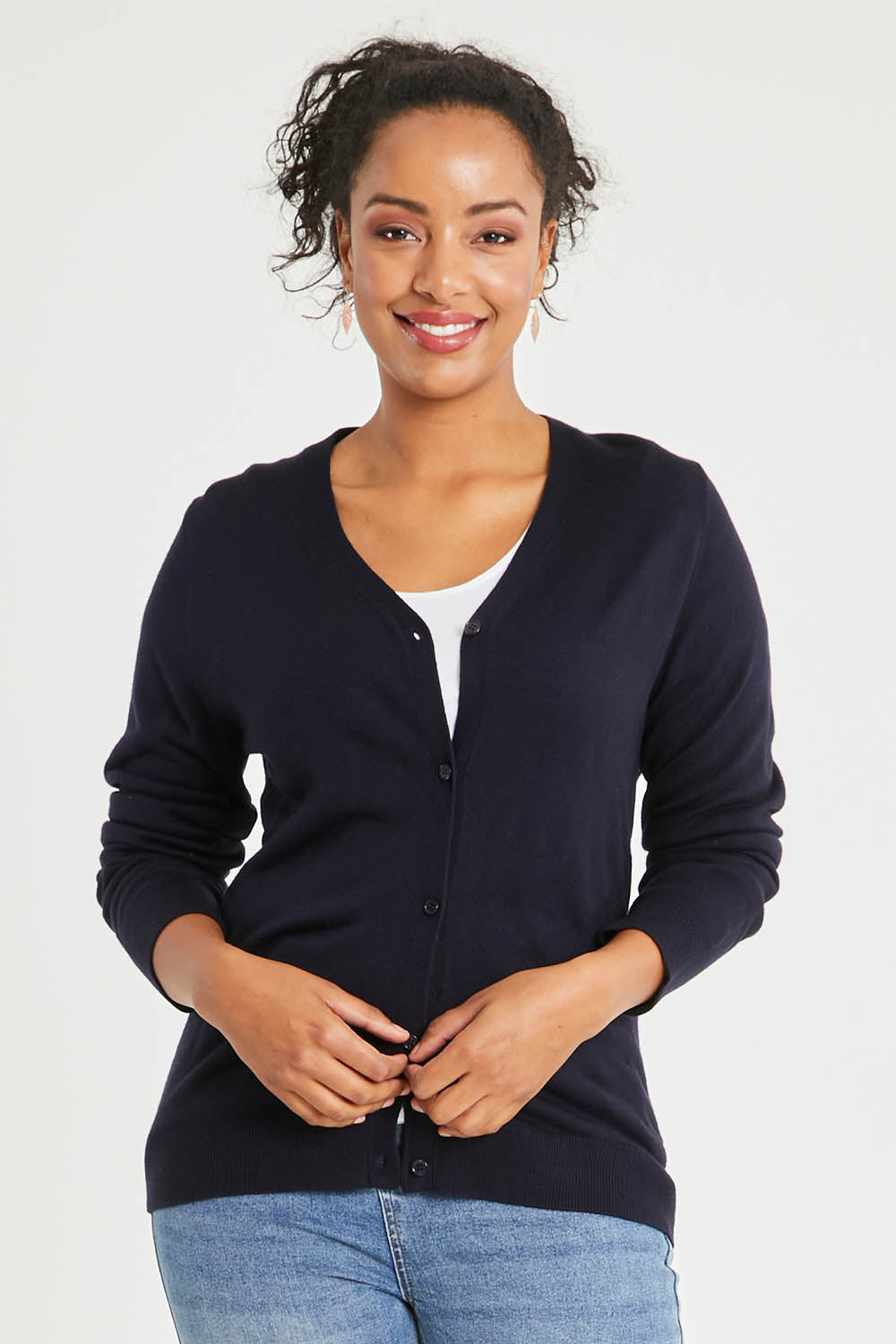 Model Noli wearing size L of The Keepers Soft Button Up Cardigan in colour Deepnavy (Blue), from the front, cropped image
