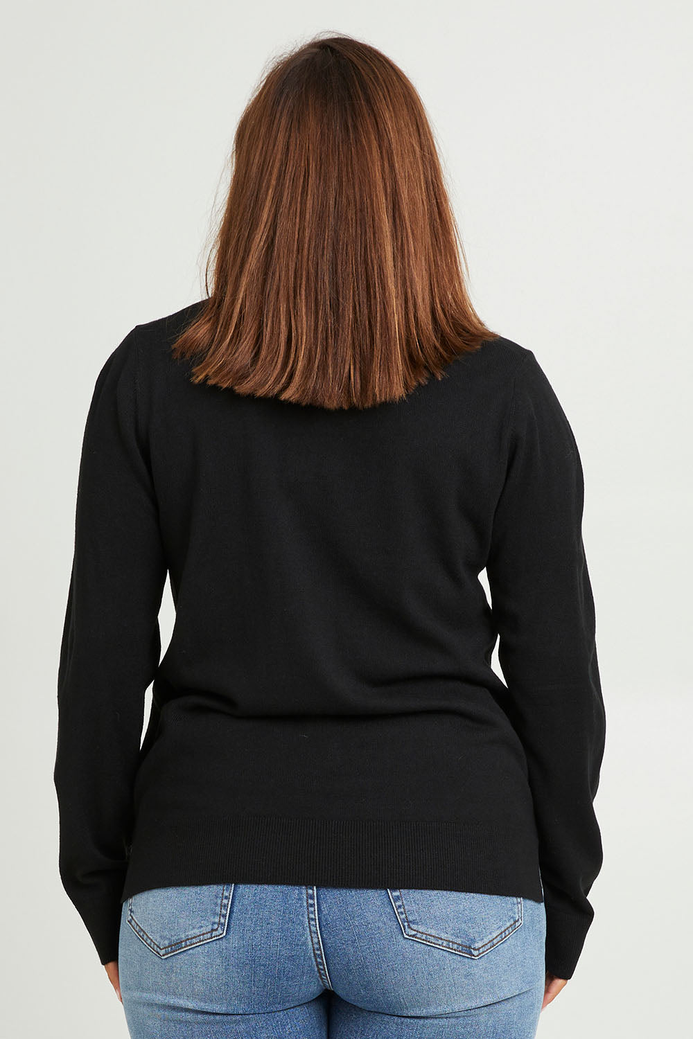 Model Monique wearing size L of The Keepers Soft Round Neck Jumper in colour Black (Black), from the back