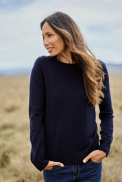 Model Amanda wearing size S of The Keepers Soft Round Neck Jumper in colour Darknavy (Blue), from the front, showing the whole outfit