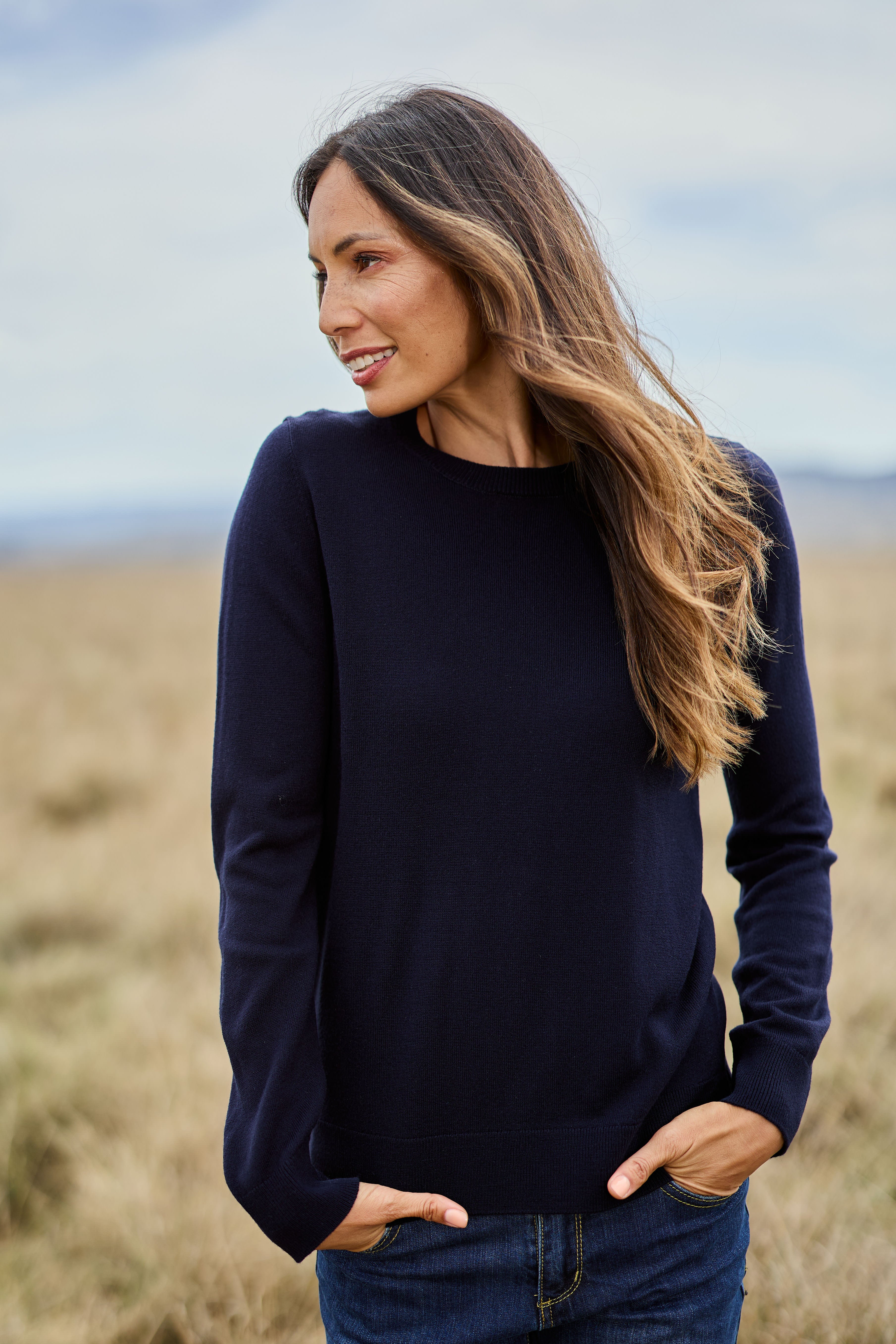 Model Amanda wearing size S of The Keepers Soft Round Neck Jumper in colour Darknavy (Blue), from the front, showing the whole outfit