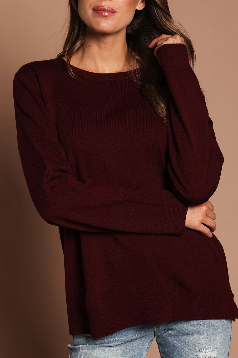 Model Madeline wearing size S of The Keepers Soft Round Neck Jumper in colour Firered (Red), from the front, cropped image