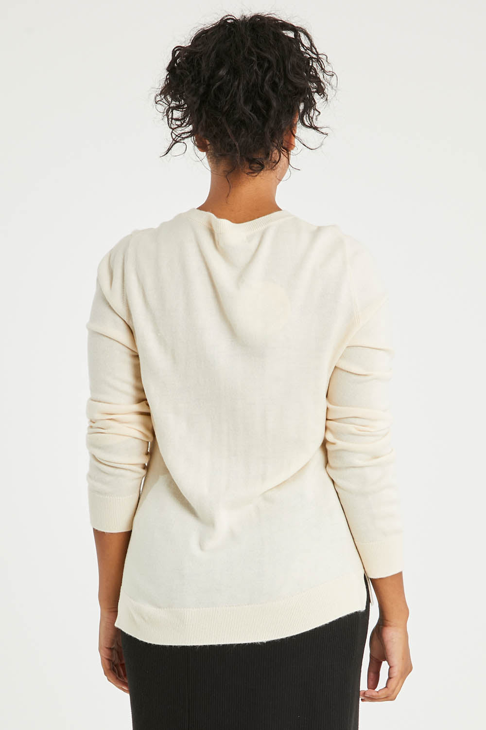Model Noli wearing size L of The Keepers Soft Round Neck Jumper in colour Ivory (White), from the back
