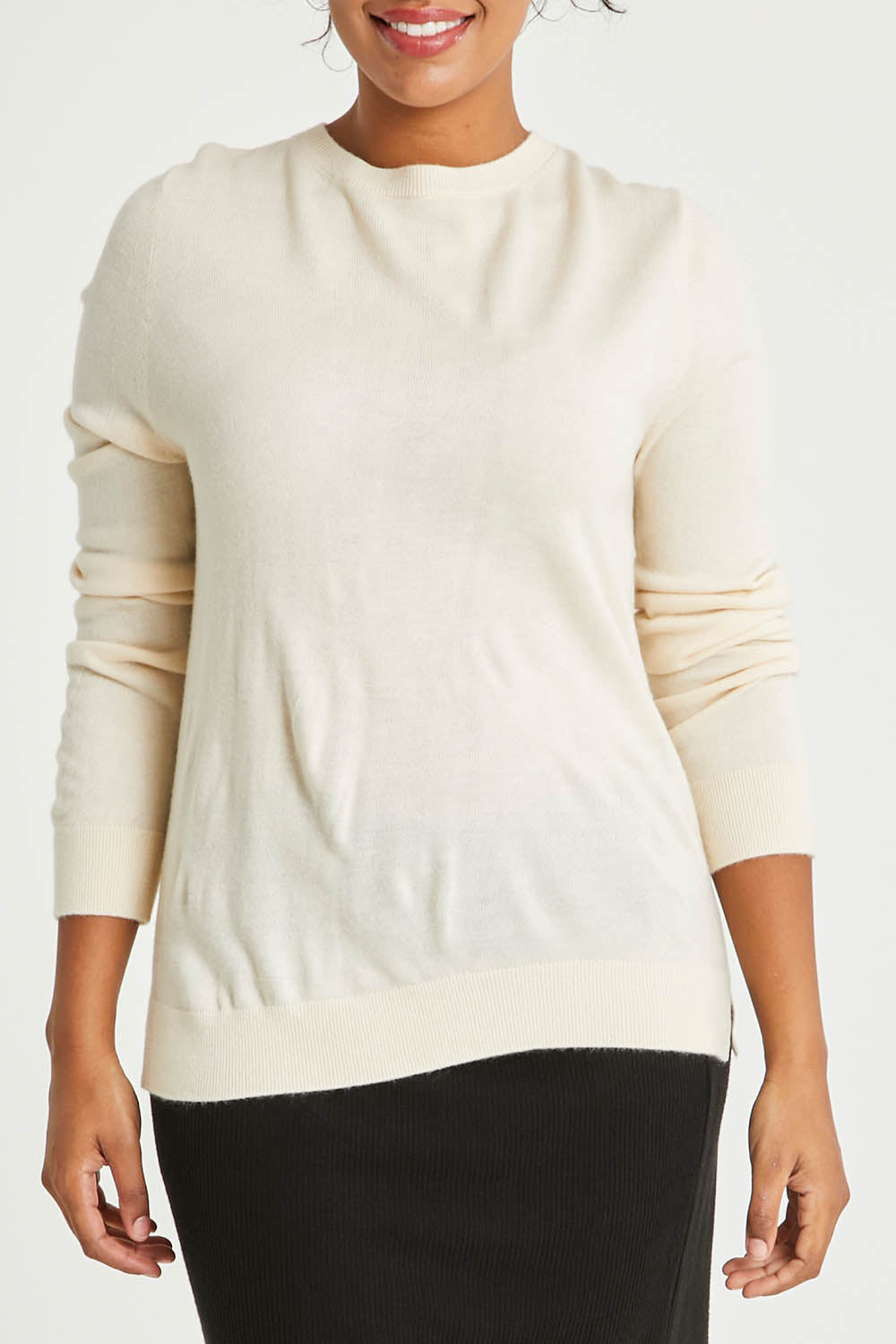 Model Noli wearing size L of The Keepers Soft Round Neck Jumper in colour Ivory (White), from the front, cropped image