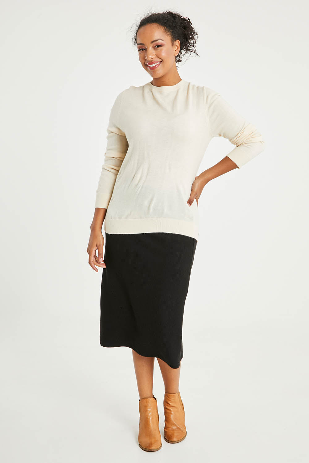 Model Noli wearing size L of The Keepers Soft Round Neck Jumper in colour Ivory (White), from the front, showing the whole outfit