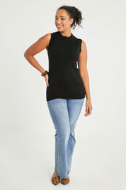 Model Noli wearing size L of The Soft Sleeveless Mockturtle Jumper in colour Black (Black), from the front, showing the whole outfit