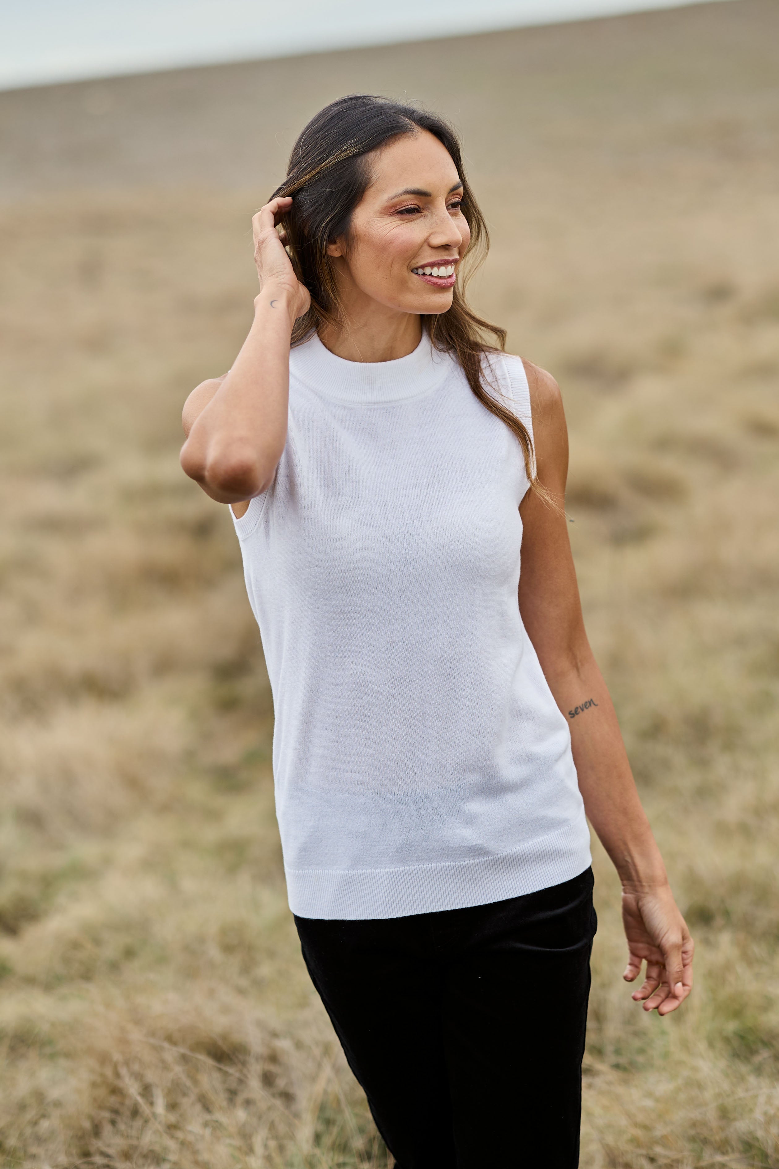 Model Amanda wearing size S of The Soft Sleeveless Mockturtle Jumper in colour White (White), from the front, showing the whole outfit