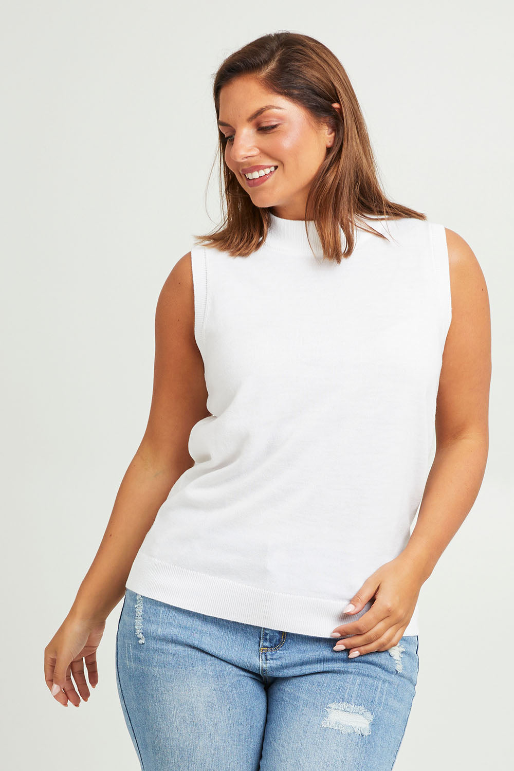 Model Monique wearing size L of The Soft Sleeveless Mockturtle Jumper in colour White (White), from the front, cropped image