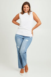 Model Monique wearing size L of The Soft Sleeveless Mockturtle Jumper in colour White (White), from the front, showing the whole outfit