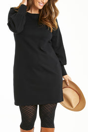 Model Laura wearing size 14 of The Keepers Classic Ponte Dress in colour Black (Black), from the front, cropped image