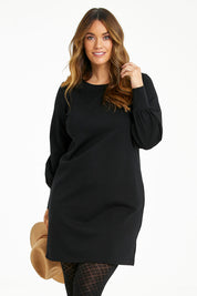 Model Laura wearing size 14 of The Keepers Classic Ponte Dress in colour Black (Black), from the front, cropped image