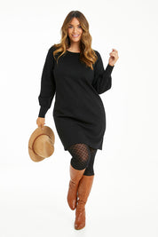 Model Laura wearing size 14 of The Keepers Classic Ponte Dress in colour Black (Black), from the front, showing the whole outfit