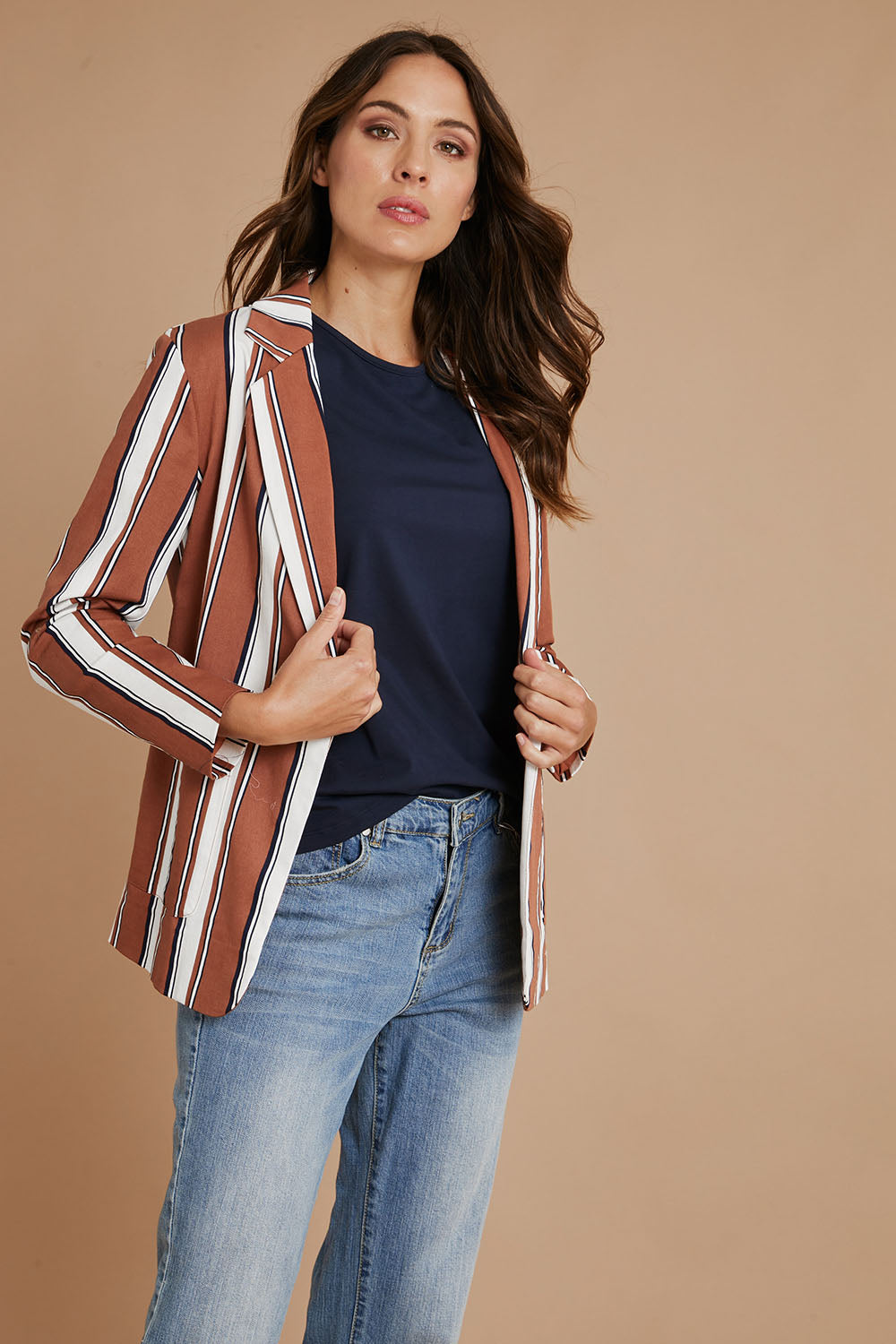 Model Madeline wearing size 10 of The Classic Stripe Blazer in colour Navyrust (Blue), from the front, showing the whole outfit