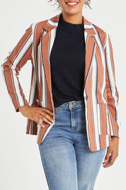 Model Noli wearing size 14 of The Classic Stripe Blazer in colour Navyrust (Blue), from the front, cropped image