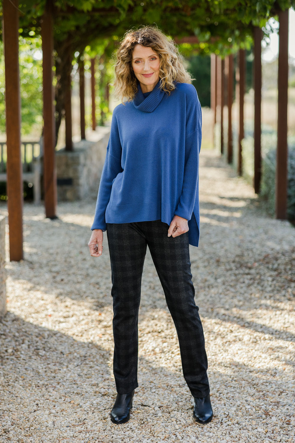 Model Emma wearing size 10 of The Ponte Check Pant in colour Blackgrey (Black), from the front, showing the whole outfit