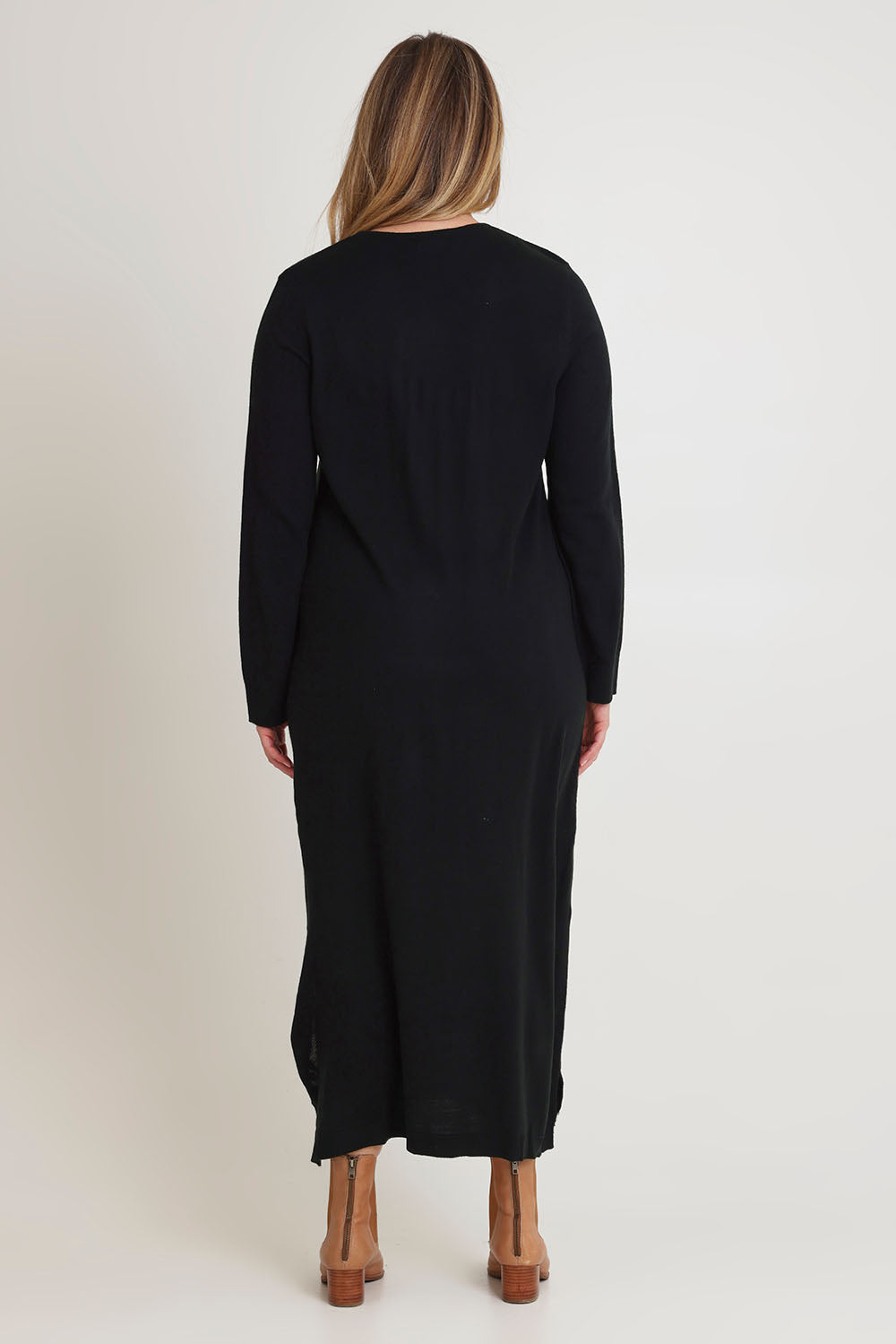 Model Chanel wearing size XL of The Keepers Soft Knit Maxi Dress in colour Black (Black), from the back