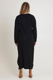 Model Chanel wearing size XL of The Keepers Soft Knit Maxi Dress in colour Black (Black), from the back