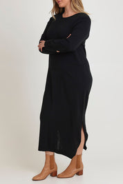 Model Chanel wearing size XL of The Keepers Soft Knit Maxi Dress in colour Black (Black), from the front, cropped image